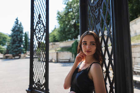 Charming red-haired teen girl in the Park posing for the cameraの写真素材