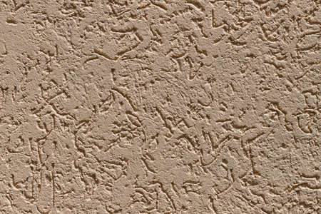 Pattern of decorative plaster "bark beetle" on the wall of the house. Color-dark peachの写真素材