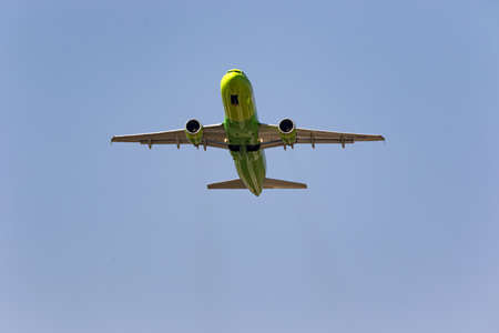 MINERALNYE VODY - SEPTEMBER 05: Airbus A320 of S7 airlines with tail number VQ-BRD flies over the observer. View from the ground to the plane. September 05, 2020 in Mineralnye Vody, Russia.のeditorial素材