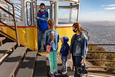 PYATIGORSK - OCTOBER 10: Special rules on the cable car - visitors and staff must wear protective masks. October 10, 2020 in Pyatigorsk, Russia.のeditorial素材