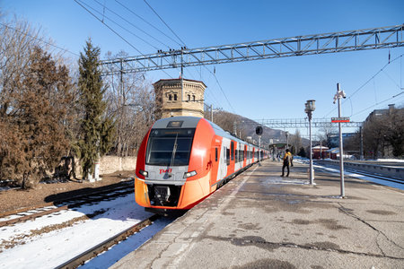 PYATIGORSK - JANUARY 22: High-speed train "Lastochka" plying between the resort cities arrives at the railway station. January 22, 2021 in Pyatigorsk, Russia.のeditorial素材