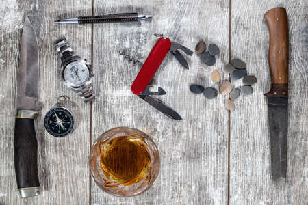 Men's items and accessories: knife, whiskey glass, stylish pen, watch and compassの写真素材