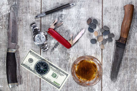 Men's items and accessories: knife, whiskey glass, stylish pen, watch and compassの写真素材