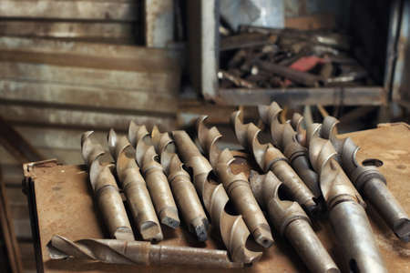 Old Large Diameter Metal Drill Bits from Industrial Drilling Machineの写真素材
