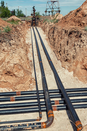 The lines of technological pipelines in special anti-corrosion insulation are laid on the bottom of the trenchの写真素材