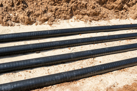 The lines of technological pipelines in special anti-corrosion insulation are laid on the bottom of the trenchの写真素材