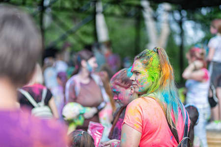 ESSENTUKI- JUNE 20: Happy participants of the open-air paint festival with painted faces and clothes. June 20, 2021 in Essentuki, Russia.のeditorial素材