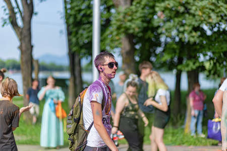 ESSENTUKI- JUNE 20: Happy participants of the open-air paint festival with painted faces and clothes. June 20, 2021 in Essentuki, Russia.のeditorial素材