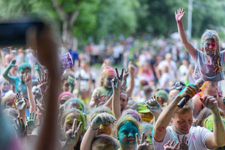 ESSENTUKI- JUNE 20: Happy participants of the open-air paint festival with painted faces and clothes. June 20, 2021 in Essentuki, Russia.のeditorial素材