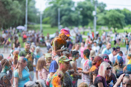 ESSENTUKI- JUNE 20: Happy participants of the open-air paint festival with painted faces and clothes. June 20, 2021 in Essentuki, Russia.のeditorial素材