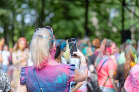 ESSENTUKI- JUNE 20: Happy participants of the open-air paint festival with painted faces and clothes. June 20, 2021 in Essentuki, Russia.のeditorial素材