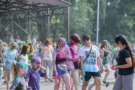 ESSENTUKI- JUNE 20: Happy participants of the open-air paint festival with painted faces and clothes. June 20, 2021 in Essentuki, Russia.のeditorial素材