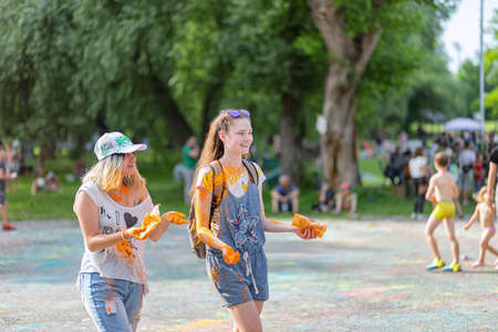 ESSENTUKI- JUNE 20: Happy participants of the open-air paint festival with painted faces and clothes. June 20, 2021 in Essentuki, Russia.のeditorial素材
