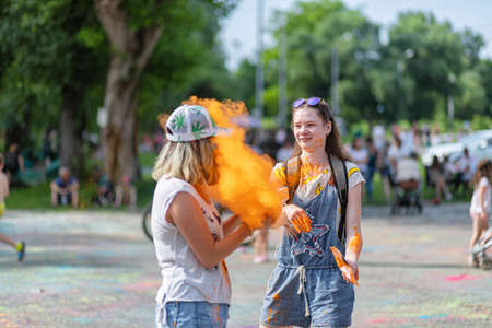 ESSENTUKI- JUNE 20: Happy participants of the open-air paint festival with painted faces and clothes. June 20, 2021 in Essentuki, Russia.のeditorial素材