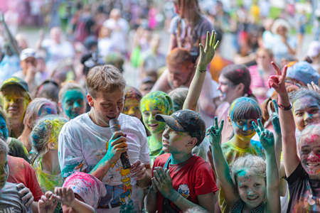 ESSENTUKI- JUNE 20: Happy participants of the open-air paint festival with painted faces and clothes. June 20, 2021 in Essentuki, Russia.のeditorial素材