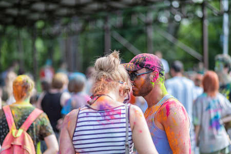 ESSENTUKI- JUNE 20: Happy participants of the open-air paint festival with painted faces and clothes. June 20, 2021 in Essentuki, Russia.のeditorial素材