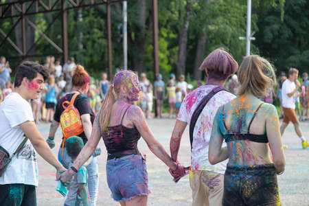 ESSENTUKI- JUNE 20: Happy participants of the open-air paint festival with painted faces and clothes. June 20, 2021 in Essentuki, Russia.のeditorial素材