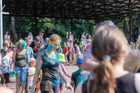 ESSENTUKI- JUNE 20: Happy participants of the open-air paint festival with painted faces and clothes. June 20, 2021 in Essentuki, Russia.のeditorial素材