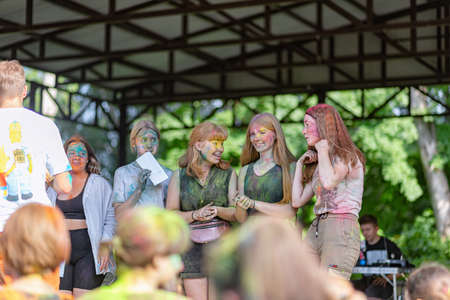 ESSENTUKI- JUNE 20: Happy participants of the open-air paint festival with painted faces and clothes. June 20, 2021 in Essentuki, Russia.のeditorial素材
