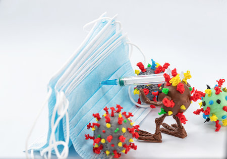 Viruses attack the barrier of protective medical masksの写真素材