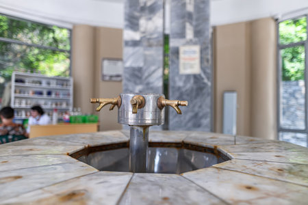 An old drinking source of useful mineral water equipped with taps for touristsの写真素材