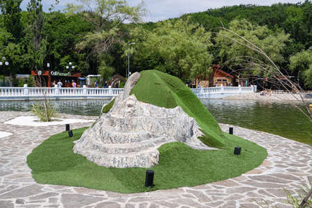 ZHELEZNOVODSK - JULY 04: miniature models of all the mountains of the Caucasian mineral waters installed on the city lake. July 04, 2021 in Zheleznovodsk, Russia.のeditorial素材