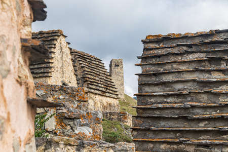 The City of the Dead is a place of burial of ancestors in the Caucasus in special crypts with two and four-pitched roofsの写真素材
