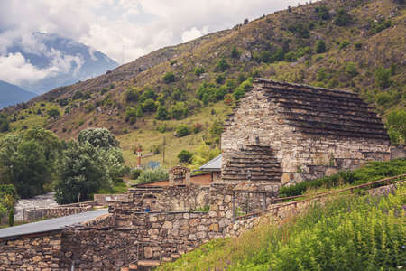 A small, ancient temple in a high-mountain village. A sacred place for the worship of local saints in North Ossetia.の写真素材