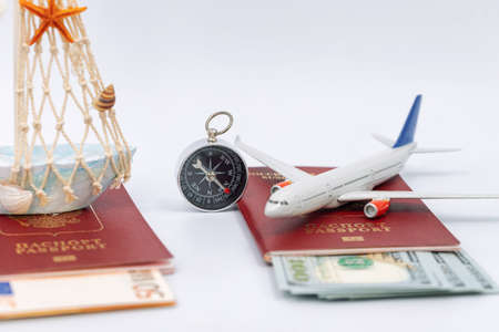Toy airplane and boat, passports and cash dollarsの写真素材