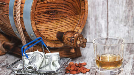 Oak barrel, roasted almonds, glass of whiskey and cigarの写真素材