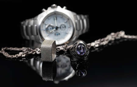 Men's watches in titanium case and women's jewelry made of silverの写真素材