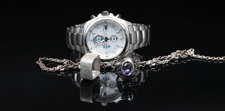 Men's watches in titanium case and women's jewelry made of silverの写真素材