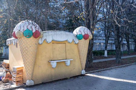 ESSENTUKI - OCTOBER 12: Ice cream stall decorated with pillars in the shape of an ice cream cone. October 12, 2021 in Essentuki, Russiaのeditorial素材