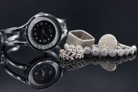 Elegant womens watches in a metal case and jewelry made of silverの写真素材