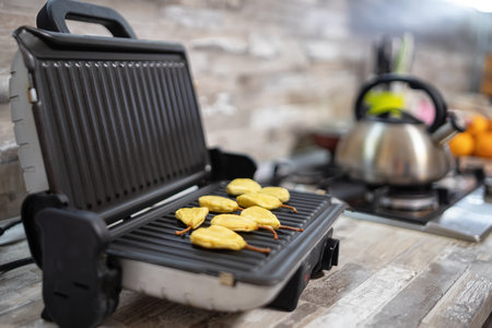 Improper use of grill in the kitchen - preparation of dried fruits from pearsの写真素材