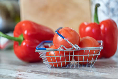 Concept: fast delivery of fresh vegetables from the store to your kitchenの写真素材
