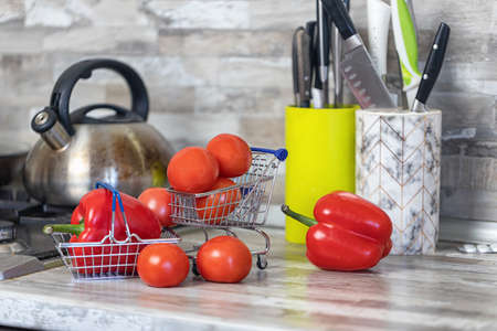 Concept: fast delivery of fresh vegetables from the store to your kitchenの写真素材
