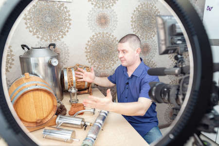 Young White Man Blogs About Distillation and Whiskey Production at Home