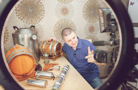Young White Man Blogs About Distillation and Whiskey Production at Homeの写真素材