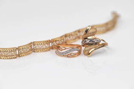Engagement ring of gold and different weave chainの写真素材