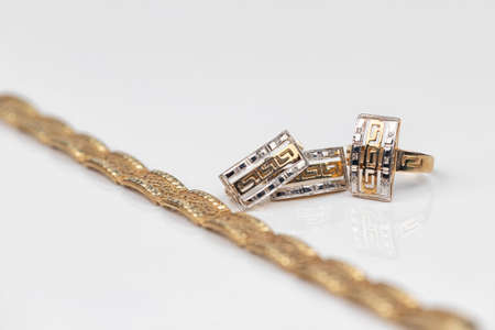 set of gold earrings and gold ringの写真素材