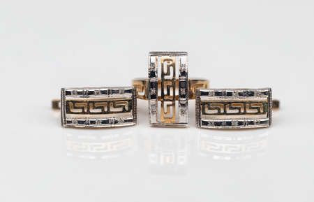 set of gold earrings and gold ringの写真素材