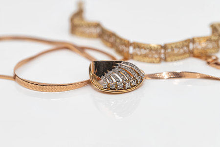 Engagement ring of gold and different weave chainの写真素材