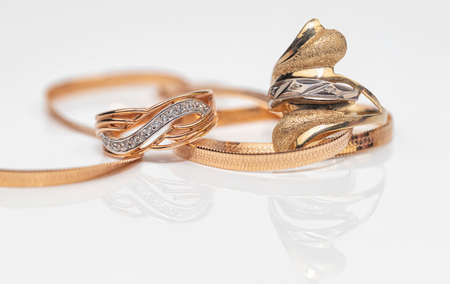 Engagement ring of gold and different weave chainの写真素材