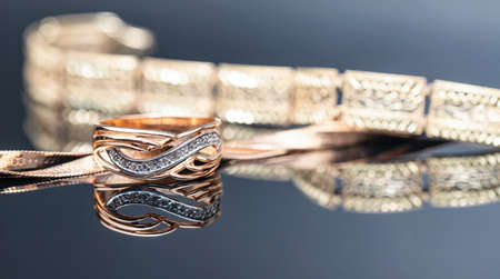 Elegant gold ring decorated with small precious stonesの写真素材