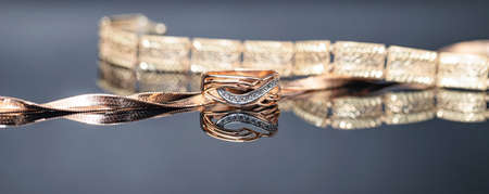 Elegant gold ring decorated with small precious stonesの写真素材