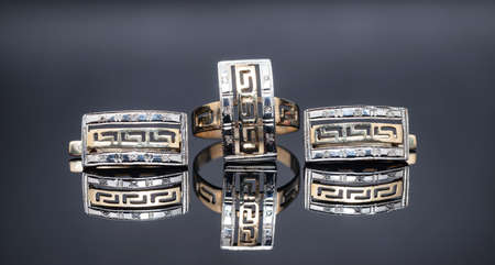 set of gold earrings and gold ringの写真素材
