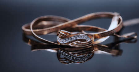 Elegant gold ring decorated with small precious stonesの写真素材