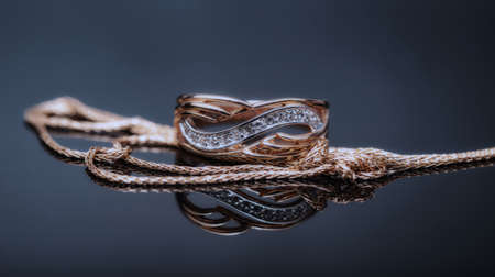Elegant gold ring decorated with small precious stonesの写真素材