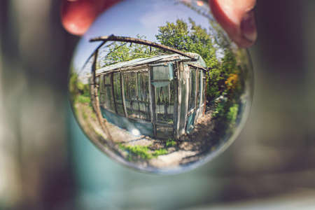 View of the old wooden frame greenhouseの写真素材